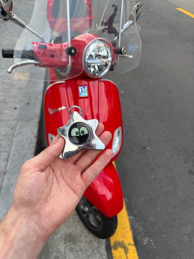 Oneira campaign image styled against a red scooter