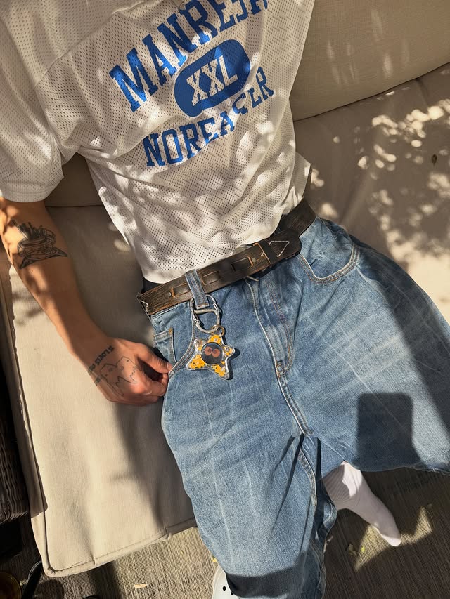 A pocket companion device tucked into the pocket of a denim jacket